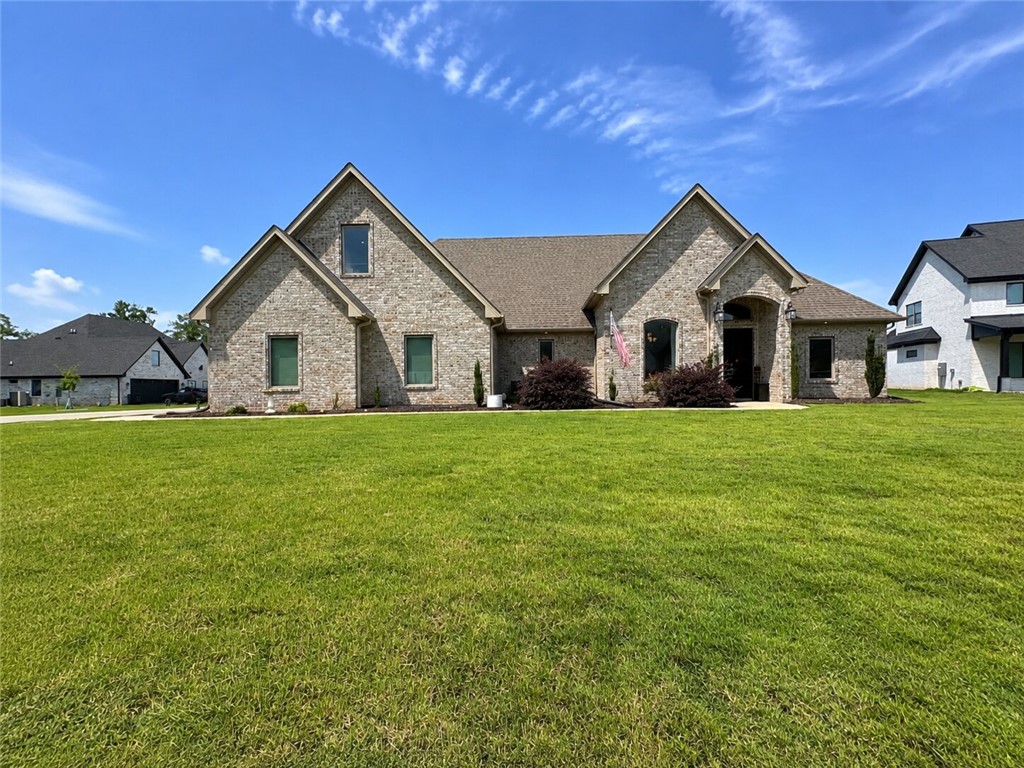 Hurricane Lake Estates! This beautiful 4 bed 3 bath brick home sits on a level corner lot in a quiet cul-de-sac & offers the perfect blend of luxury & functionality. Open-concept floor plan features fresh paint, new flooring, soaring ceilings, crown molding, & abundant natural light throughout. Spacious primary suite includes private patio access & a spa-like bath w/double vanities, honed granite countertops, tiled shower, luxury jetted tub w/Bluetooth speakers, waterfall faucet, & an oversized walk-in closet connected directly to the laundry room. The laundry room offers built-in cabinetry, granite counters, sink, & under-stair storage. Two large guest bedrooms are located separately from the primary suite, while the huge upstairs bedroom could easily serve as a second master, bonus room, or media space. On demand hot water throughout. Outdoor kitchen, & oversized side-entry two-car garage. Enjoy access to Hurricane Lake amenities including the clubhouse, pool, pickleball/tennis courts, & boat launch/lake access.