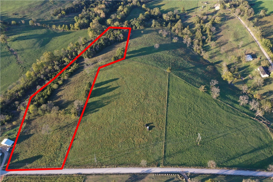 Tract # 1 is a beautiful 7.93 acres that is ideally located just off Hwy 221 N of Berryville in one of the area's most desirable locations for building your dream home. Situated only 3/4 of a mile of a mile down a well-maintained white chat road, the property offers the perfect balance of peaceful country living and convenient to town. The land is fully fenced and features an excellent mix of open pasture and privacy, making it ideal for horses, cattle, or simply enjoying your own space in the country. Surrounded by mature trees, this tract provides both comfort and seclusion. If your looking to build a custom home, start a hobby farm, or invest in quality acreage with great potential, this property checks all the boxes. Scenic views, usable pasture, and a prime location just minutes from town. Don't miss this opportunity to own a beautiful piece of the Ozarks.