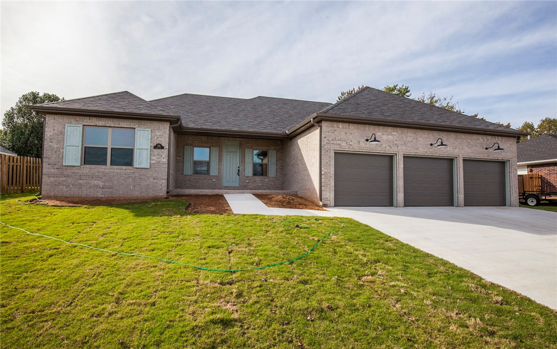 Beautiful new construction home in Lowell. Great open floor plan, vinyl plank wood style flooring throughout home. Gas fire place in living room with custom tile, Granite counters, Stainless appliances, split floor plan, many upgrades, surround sound in living room,  3 car garage, fenced yard, covered patio area.