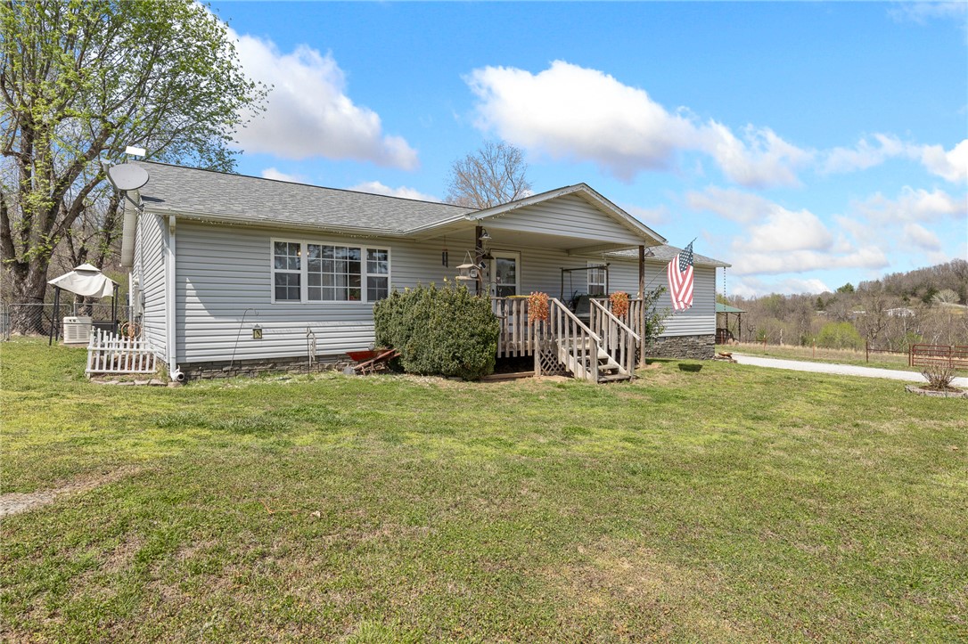 Feeling Farmy?  If so, you need to come check out 2249 MC 4019 in Everton, AR.  This established farm has 23 acres, wet weather creeks on two sides, a 10 x 20 chicken coop, a stacking shed and a 4 bedroom (possibly 5th or office), 2 bathroom home with a recently remodeled kitchen – all on pavement.  This place has been in the same family since the 1950s and also offers a separate place to build an additional home with utilities already in place.  With two wells and two water meters the new owner can choose their water source preference.  Speaking of water, the house also comes with an above ground 16 x 30 freshwater pool and deck for cooling off after tending to the livestock.  This place is already fenced and cross-fenced, new roof in 2020, a whole house generator, and has mature peach and pear trees along with thornless blackberry bushes.  If you want to escape the city life and come home to your ready made farm, come take a look at this place.
