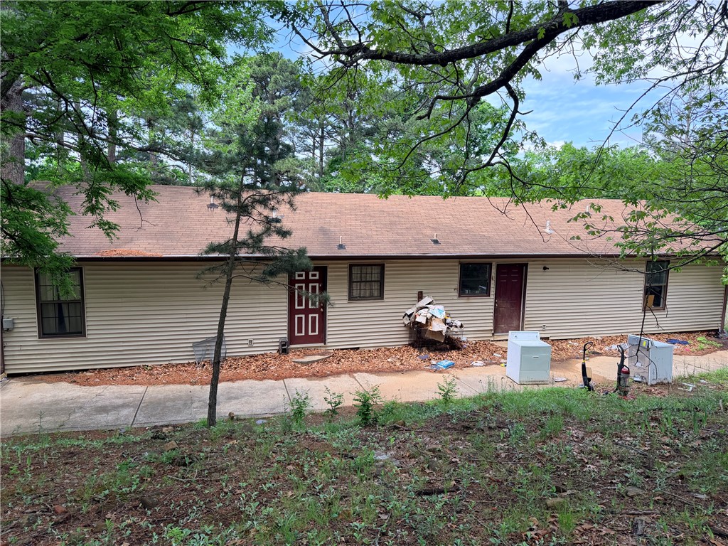 Duplex across from Cliff House Restaurant in Jasper. So many possibilities to make an Airbnb, two small rentals or live in one side and rent out the other side. Covered porch along back side of home. Between Jasper and Deer. Buffalo River nearby. Property will need updating. Selling AS-IS. Property will not go VA, RD or FHA. All numbers approximate. Age and sq ft per Assessor's office. NO OFFERS ACCEPTED UNTIL 5/26/26.