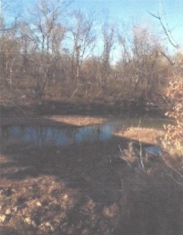 Gently rolling land just 10 minutes to Fayetteville square.  Wooded and open.  Frontage on White River.  Electric and Fayetteville water available.  Septic needed.