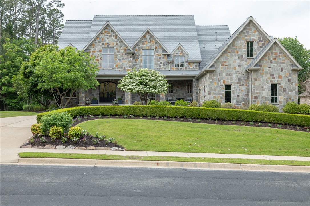 Absolutely INCREDIBLE Tudor ROCK home in Clear Creek S/D situated around Blessings Golf Course.  7,540 heated sq ft includes 5 bedrooms, 4 full bathrooms, 3 half bathrooms, study, great room,  formal dining, open eat in kitchen to living, wet bar, separate laundry, bonus, and a full media room.  The amenities in this home are truly REMARKABLE and include Thermador and Sub Zero appliances, Taj Mahal quartzite, Visual Comfort lighting, BRAND NEW DaVinci Composite roof, Philip Jeffries wallpaper, sand and stain REAL hardwood floors, Custom steel front door, 3 fireplaces, wrought iron fencing, 5 car garage w/ epoxied floors, grilling patio, and a perfectly landscaped backyard.  These are just SOME of our favorite features, there are so many more!!!!  Zoned for Fayetteville Schools. Backs up to the 12th Green on the golf course.