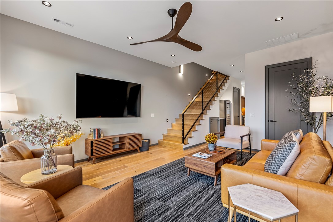 Modern design meets downtown convenience in this stylish 3 bedroom, 3.5 bathroom townhome in the heart of Bentonville. The functional floor plan includes a bedroom on the first floor, offering flexibility for guests or multi-generational living. This residence features open living spaces, high-end modern finishes, quartz counters, and abundant natural light throughout. A 1-car garage provides private parking and additional storage—an uncommon amenity for downtown. Perfectly located near trails, Crystal Bridges Museum of American Art, and the Downtown Square, this home offers a rare opportunity to enjoy the walkable and bikeable Bentonville lifestyle.