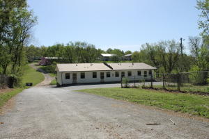 Great Investment property! 7 unit apartment building with a Laundromat, a 3 bedroom home and 3 mobile homes. 2.47 ac. Great location! Full occupancy is $4050 per month. Apartment building has 1-3 bedroom unit; 4-2 bedroom units; & 2-1 bedroom units. 2 mobile homes in need of repair and are not currently rented.