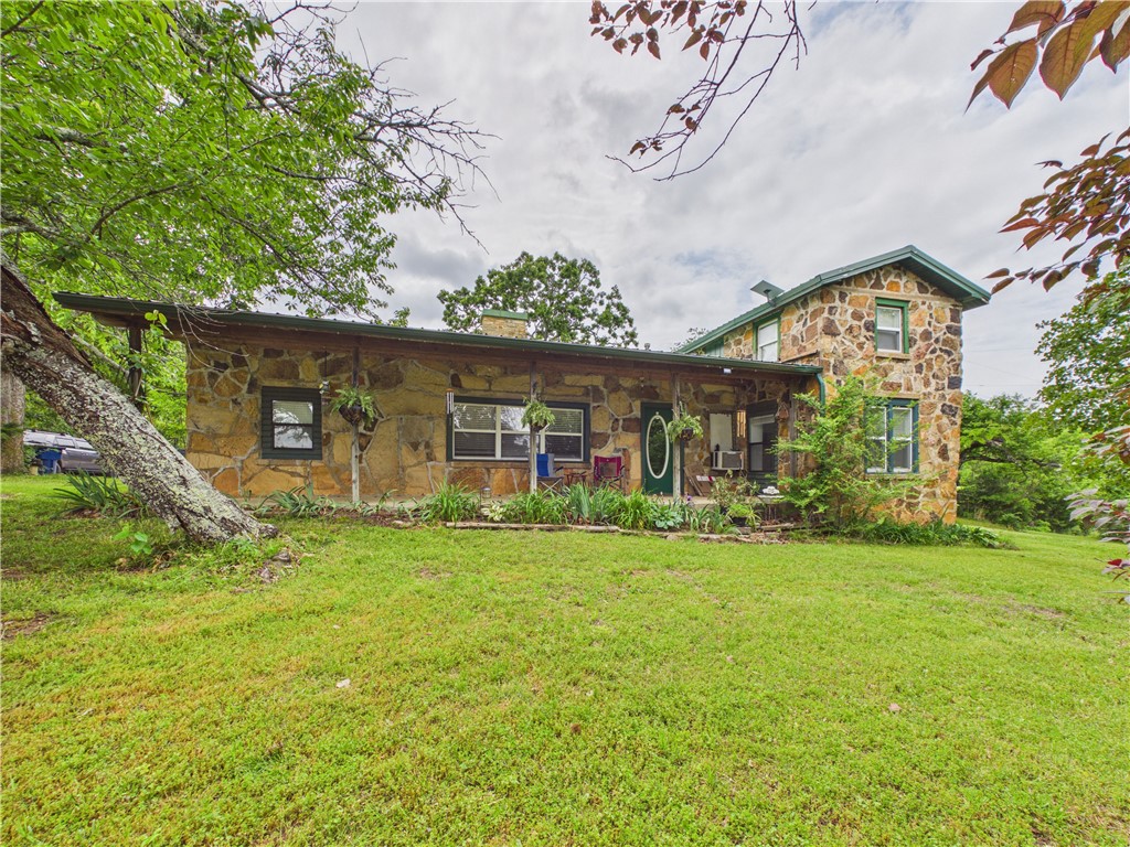 Don’t miss out on the cutest rock house in the best location.  This 1.5 acre lot provides country living all while being 10 minutes from town. This 3 bedroom/2 bathroom (one bathroom in the shop) is perfect for lazy mornings on the covered front porch sipping coffee and looking at the beautiful surroundings. Have pets?  Let them roam in and out of the sunroom through a doggy door and fenced back yard.  You’ll love the  20x40 shop that is insulated, has electric, water,  and a bathroom. Float around in the 1 year old 50x4 above ground pool. This property will make you feel like you are always on vacation.  Schedule an appointment quick for this prime Boone County, AR property.