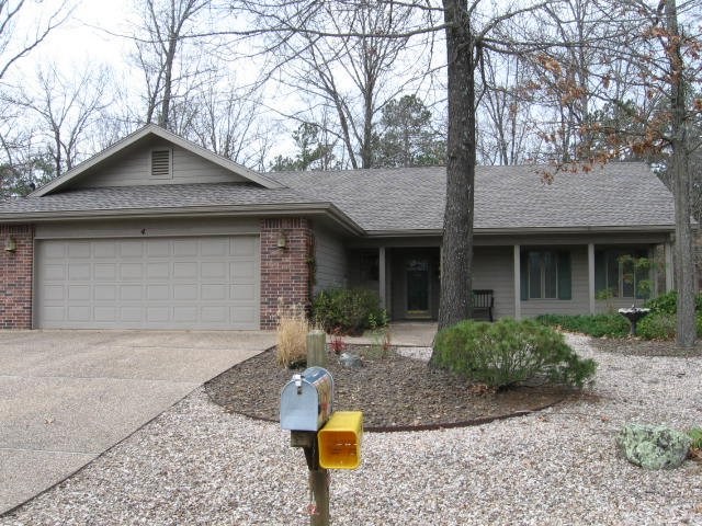Well maintained home in one of Bella Vista's desirable neighborhoods.  Home sits on level .43 lot with sewer.  Split floor plan,  nicely landscaped with no maintenance yard.  Enjoy the screened in porch that backs up to wooded view.  Oversized garage with lots of built in storage.