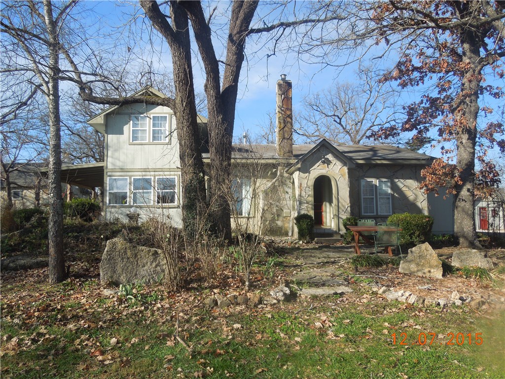 This beautiful native stone sided home has 14.28 flat acres - mostly pasture.. This fantastic home is completely updated with many modern features. Large pond and creek on property as well as historic stone barn and two guest houses. Property is 50% fenced and would make great farm - horses, cattle, poultry, etc. Acreage is unrestricted. Beautiful mountain views. Home and two guest cottages are in excellent condition and ready to move in. Easy access to Branson and Table Rock Lake.