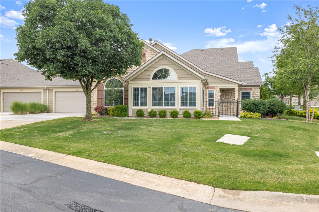 Beautifully Renovated Townhome in The Arbors Community! An unbeatable location, just across the Street from Osage Park and quick access to shopping, dining, and grocery. Less than 5 minutes to Downtown Bentonville. Enjoy maintenance free living in this luxuriously upgraded home, featuring spacious open living, 2 bedrooms and 2 bathrooms along with abundant storage and private 2 car garage. Entry welcomes you into the living space, with beautiful wood floors and a fireplace feature. Bright and airy sunroom off living provides additional lounge space. Stunning kitchen boasts large island and granite counters, along with custom cabinetry and pull out drawers. Gas cooktop and build in appliances. Primary suite has attached bath and WIC. Guest bedroom and full bathroom provide ample space. Laundry room has attached storage room. Welcome Home!