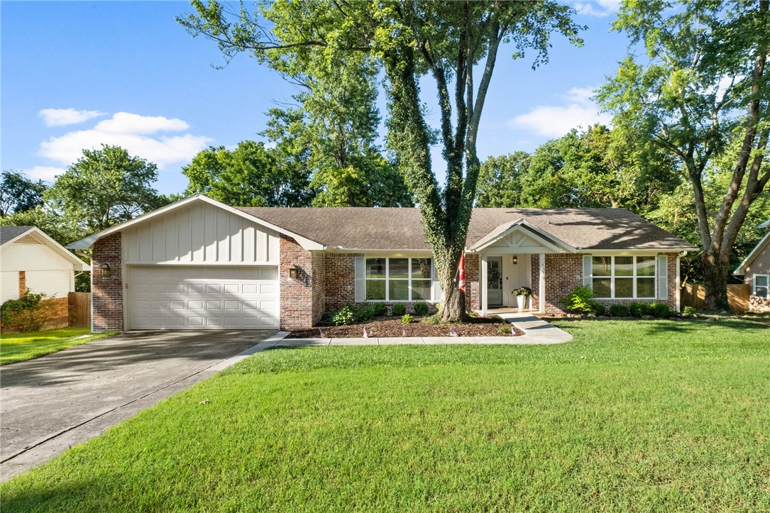 Complete top-to-bottom transformation in the heart of Fayetteville! Tucked away on a quiet cul-de-sac, this stunning 3BR/2BA traditional brick home has been completely reimagined with high-end designer finishes. Step inside to an airy open floor plan featuring a spacious living room with custom built-ins and a modern fireplace. The showstopping gourmet kitchen boasts vibrant blue custom cabinetry, white quartz countertops, premium stainless appliances, and a cozy built-in dining banquet. Retreat to the expanded primary suite, a true oasis complete with a spa-like bath featuring a freestanding soaking tub, a massive custom-tiled walk-in shower, and a dual vanity. Total peace of mind with a brand-new HVAC, new water heater, fresh paint, and modern flooring throughout. Outside, enjoy a massive, fully fenced backyard shaded by mature trees. Unbeatable location—walk or bike to top-rated Root Elementary and Gulley Park! Turn-key perfection!