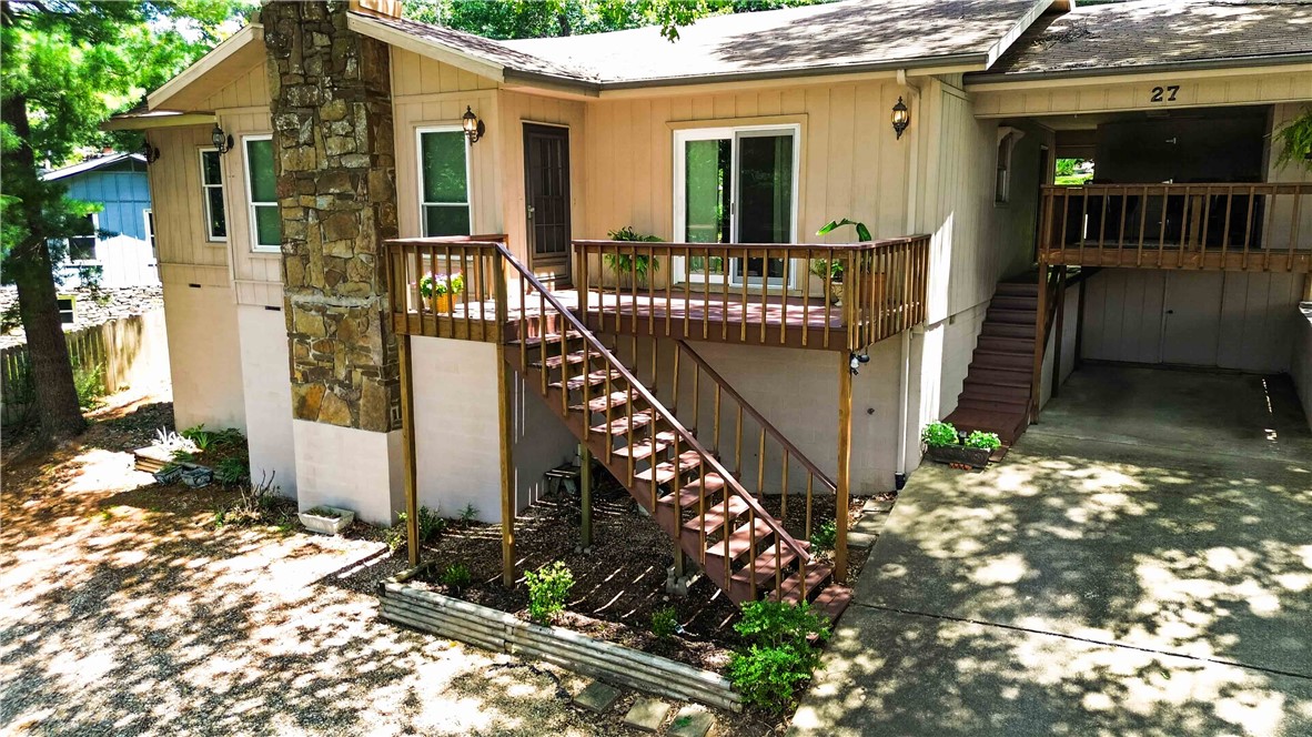 Tucked into Bella Vista’s Wimbledon subdivision, this cozy 3-bed, 2-bath home is the kind of place you fall for the moment you walk in — high ceilings, easy access to nature, and a winter view of Lake Windsor that never gets old. Sit on the porch and listen to Tanyard Creek waterfall in the background, or curl up by the family room fireplace on a cold evening for the coziest kind of quiet. Brand new laminate flooring runs throughout, and the primary suite has its own private deck access — the owner’s favorite spot in the whole house. You’re 5-10 minutes from lakes, bike trails, pools, golf, tennis, and pickleball, with quick access to I-49, all while feeling tucked away in nature. Sweet neighbors, unbeatable location — this one’s darling, and it’s easy to see why it’s hard to leave.