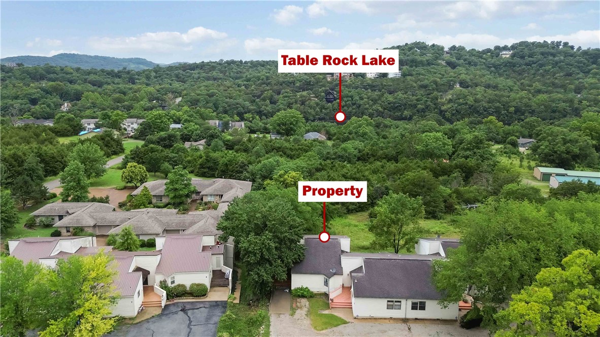 Unlock potential with this versatile 3-bedroom, 2-bath condo just 3 blocks from Table Rock Lake. Whether you're looking for a short-term rental, weekend getaway, or hybrid investment, this property checks every box. What truly sets this property apart is the unfinished basement, offering a rare opportunity to expand and potentially create additional rental units, significantly increasing cash flow and long-term value. Located in a high demand vacation market near Eureka Springs, and surrounded by established, highly rated vacation rentals, the area is consistently attracting guests year round for boating, fishing, hiking, and the charm of the surrounding area. This condo is well suited to capitalize on that demand with a spacious layout, updated flooring, private balcony, and the ability to comfortably accommodate larger groups. Low maintenance living and strong rental appeal make this an attractive option for both new and experienced investors. Only 0.5 miles to the marina and 7 miles from historic Eureka Springs!
