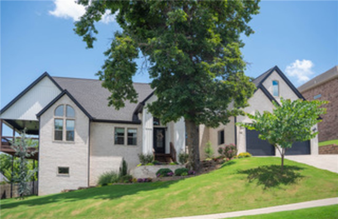 Experience Luxury in an outstanding location—just a short walk to the new Razorback Greenway extension and a quick 3-minute commute to the OZ bike trail and lift, 12-minute drive to Walmart Home Office campus. This stunning home features beautiful hardwood floors, soaring cathedral ceilings, and a bright, open layout centered around a spacious, entertainer’s kitchen. The main level offers a private primary suite, two bedrooms with a Jack-and-Jill bath, and a versatile office/flex space. Upstairs includes an additional bedroom with en-suite and a second living area. Enjoy the wraparound deck for relaxing or entertaining, 3 car tandem garage, plus a 11.5 x 40 climate-controlled shop with garage door and extensive storage—ideal for tools, toys, or recreational gear. This home seamlessly blends comfort, function, and upscale style. Schedule your private showing today.