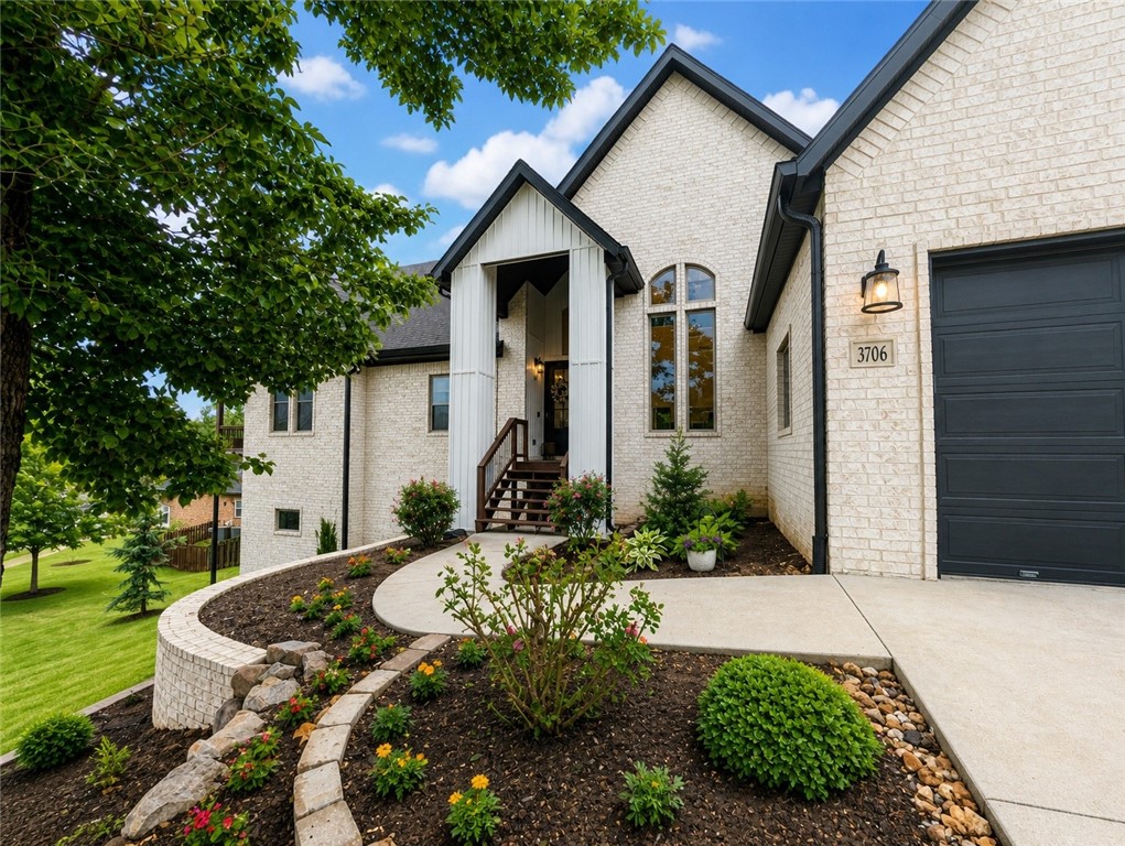 Elegant luxury living in an unbeatable location—just a short walk to the new Razorback Greenway extension and a quick 3-minute commute to the OZ bike trail and lift, perfect for outdoor enthusiasts. This stunning home features beautiful hardwood floors, soaring cathedral ceilings, and a bright, open layout centered around a spacious, entertainer’s kitchen. The main level offers a private primary suite, two bedrooms with a Jack-and-Jill bath, and a versatile office/flex space. Upstairs includes an additional bedroom with en-suite and a second living area. Enjoy the wraparound deck for relaxing or entertaining, plus a 11.5 x 40 climate-controlled shop with garage door and extensive storage—ideal for tools, toys, or recreational gear. This home seamlessly blends comfort, function, and upscale style. Schedule your private showing today.