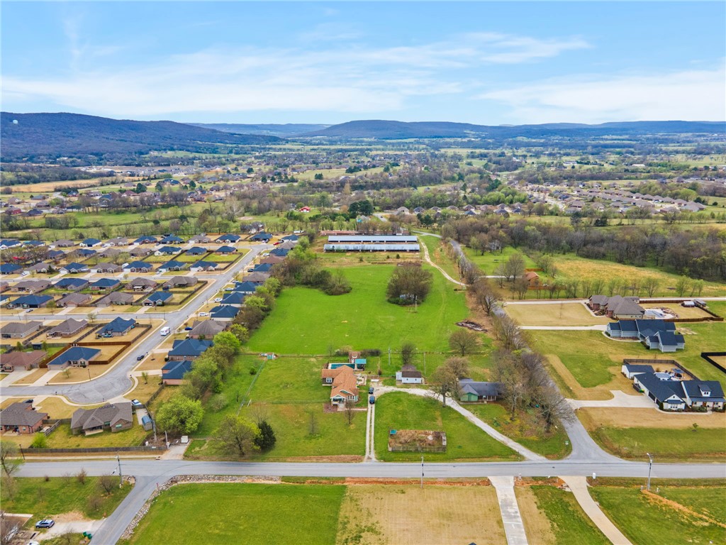 3.3 Acres m/l of open and level land waiting for the creative touch. Minutes from schools and downtown amenities. Well maintained paved road frontage. Electric, water and natural gas utilities at the street. Lot has a passing soil morphology (Perk Test). Additional adjacent acreage available if buyers prefer. Lot lines shown in pictures are estimations. Property split is pending final government approval. Also see MLS# 1338585 & 1338599