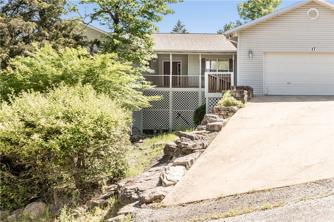 Quality built home offers split floor plan with eat-in kitchen, sliders out to deck across back.  Plenty of double-pane windows for light spacious feeling.  Living room w/cathedral ceiling centers house.  Home sits "caddy-corner" on lot, above street enough to feel private,  Sun room for  enjoying those days when you must stay indoors.  Kitchen has pantry so counters stay open, island in center for easy food prep.  Built in book shelves in 3rd BD, might be office or computer set-up
