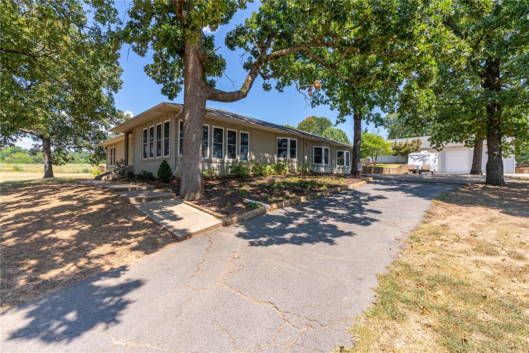 You don’t find one like this every day! Sitting on 2.87 acres this 4 bedroom 2 bath home has the perfect location, still in city limits but gives you a little bit of the country feel. Spacious kitchen completely remodeled & features all new stainless steel GE Cafe appliances, including a 5 burner gas cooktop, pull out cabinet drawers, pantry, butcher block island & quartz countertops. If you love to gather the family, there is a formal dining perfect for every day or big enough to entertain guest. The home gives you the privacy you want with a split floor plan & mud room with built-in cabinets that gives you extra storage. Both bathrooms have been remodeled & the house has all new windows. The electric fireplace in the living room gives you a nice ambience & warmth feeling. If the house is not enough, there’s a 3 bedroom 1 bath garage apartment and there is also a 40 x 40 shop with 6" concrete walls & metal beams & provides a great workspace.