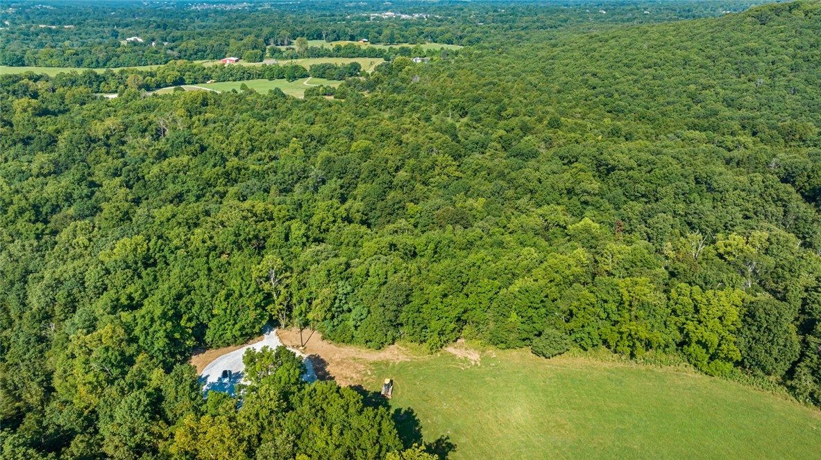 Located in Goshen Arkansas and in the Fayetteville School District you will find a rare opportunity to build your custom home on a private five acre lot (with water tap already in place) located in the prestigious Cedar Ranch Estates. Designed to preserve the natural beauty and privacy appreciated in the Goshen area, and with opportunity to design the perfect dream estate. Each lot is uniquely different ranging from beautiful valley views, to stream side oasis, to pond side elegance, to rolling grassy fields. With each lot you will have the opportunity to create a home on an estate sized lot with the unique features desired by everyone. Come visit Cedar Ranch Estates and make it your last home.