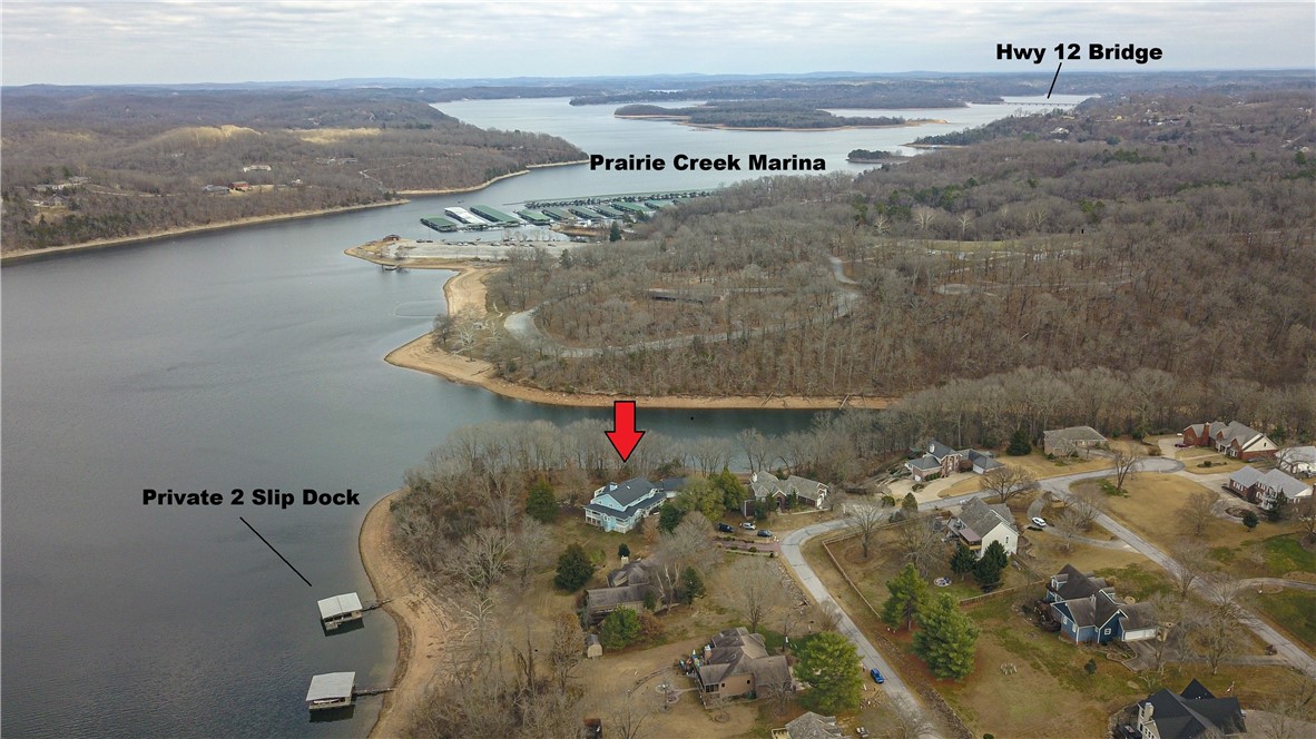 This exceptional three-story lakefront estate offers over 7,400 SF of living space, a private boat dock with 2 slips, and approximately 700 ft of pristine shoreline. Panoramic lake views are showcased throughout, creating a seamless connection to Beaver Lake from every room. All 5 bedrooms feature en-suite bathrooms and private exterior access, offering comfort, privacy, and convenience. 4 fireplaces add warmth and ambiance to multiple living and entertaining areas. Additional highlights include an insulated 3 car garage, generous storage, and thoughtfully designed indoor-outdoor living spaces
The backyard is a private oasis with expansive lake views, a covered patio, and a built-in grill with fridge—perfect for entertaining. A gentle, flat walk leads directly to the private boat dock. Peaceful and secluded, yet just five miles from Downtown Rogers, this rare property offers luxury lake living, blending tranquility with easy access to shops, dining, and local amenities. Don’t miss this opportunity on Beaver​​‌​​​​‌​‌​​​‌‌​​​‌‌‌​​‌​​‌‌​​​​ Lake