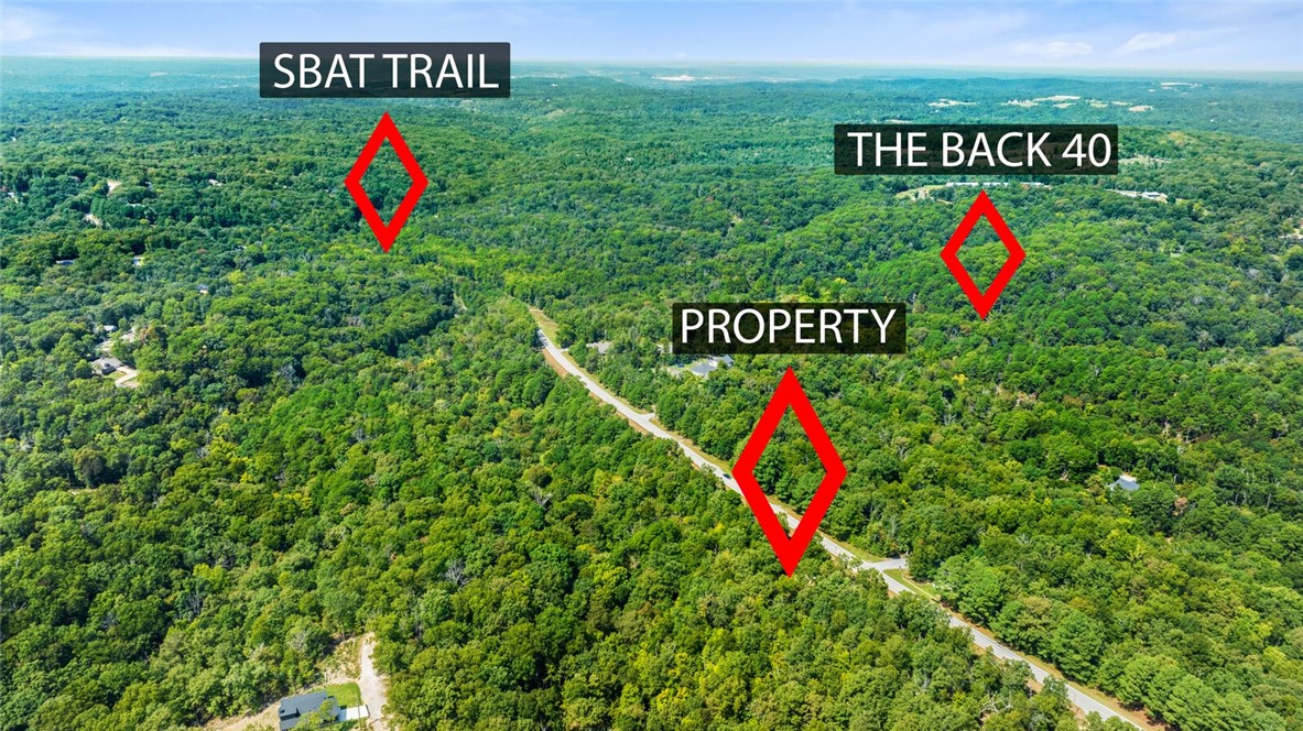 This double lot, totaling 0.70 acres, offers the perfect blend of privacy and potential. Nestled in a peaceful cul-de-sac with no homes yet, it’s ready for your custom build. The property has been perc tested and includes a septic design, survey, and house plan for a 4 bedroom home. Enjoy easy access to the Bear Hollow Trailhead and Back 40, perfect for outdoor enthusiasts. Don’t miss the opportunity to create your dream home in beautiful Bella Vista!