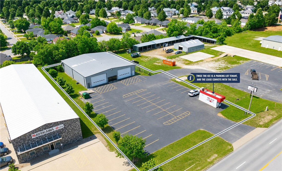 Bay doors: 2 (24' x 14').
Min wall height: 16'.
Peak height: 19'.
Parking: 35–40 spaces.
Office SF: ±1,500 SF.

This ±7,200 SF flex building offers a versatile opportunity for owner-users or investors seeking a well-positioned industrial asset along the Highway 412 corridor. Situated just 5.2 miles from Interstate 49, the property features ±1,500 SF of office space including a reception area, breakroom, three private offices, and two restrooms. Additional property highlights include two oversized bay doors (24’ x 14’), 16’ minimum wall height, 19’ peak height, and approximately 35–40 parking spaces, making the property well-suited for a variety of warehouse, service, distribution, or flex users. Additionally, the property includes an existing income-producing tenant, Twice the Ice, located within the parking lot area. The Twice the Ice lease will convey with the sale of the property and is currently generating $600 per month on a month-to-month lease, providing supplemental income for a future owner.
