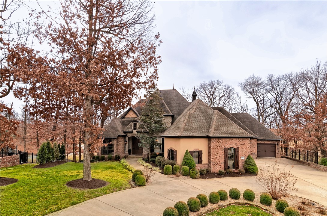 This estate-like home complete with a circle-drive and large lot, sits on a quiet cul-de-sac in the heart of Shadow Valley. The home boasts 5 bedrooms and 4.5 baths, an office with built-ins, and both a formal living room and dining area. Hand-scraped wood floors are found throughout the main living areas, the owner’s suite and upstairs hallway. Updated kitchen with quartz countertops. The family room is complete with cathedral ceilings, wood beams, and built-in bookshelves. The owner's suite boasts 12’ coffered ceilings leading to the bathroom complete with marble floors and countertops. Attached walk-in closet spacious enough for a nursery if needed. Upstairs includes 3 bedrooms and 2 large bonus rooms with new carpet, ideal for a game room or home theater. Situated on just over ¾ of an acre on a beautiful wooded lot with views of the 1st tee box and 18th green of the Shadow Valley Golf Course.   This unique property is ready for your personal touch! GOLF MEMBERSHIP INCLUDED.