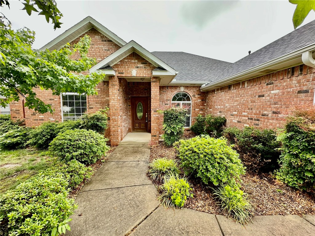 Beautiful 3-bedroom, 2-bath home in the College Place subdivision with a spacious and inviting layout. Conveniently located with easy access to I-49, Walmart, NorthWest Arkansas Community College, shopping, dining, and more. This home features an open split-floor plan with a cozy fireplace, crown molding, and hardwood floors throughout the main living areas. The spacious office includes a wall of built-in bookcases and could easily function as a 4th bedroom (no closet). Bedrooms are carpeted, with ceramic tile in wet areas for added convenience. Enjoy the attached garage and fenced backyard, perfect for relaxing or entertaining outdoors.**$250 non-refundable pet fee per pet**