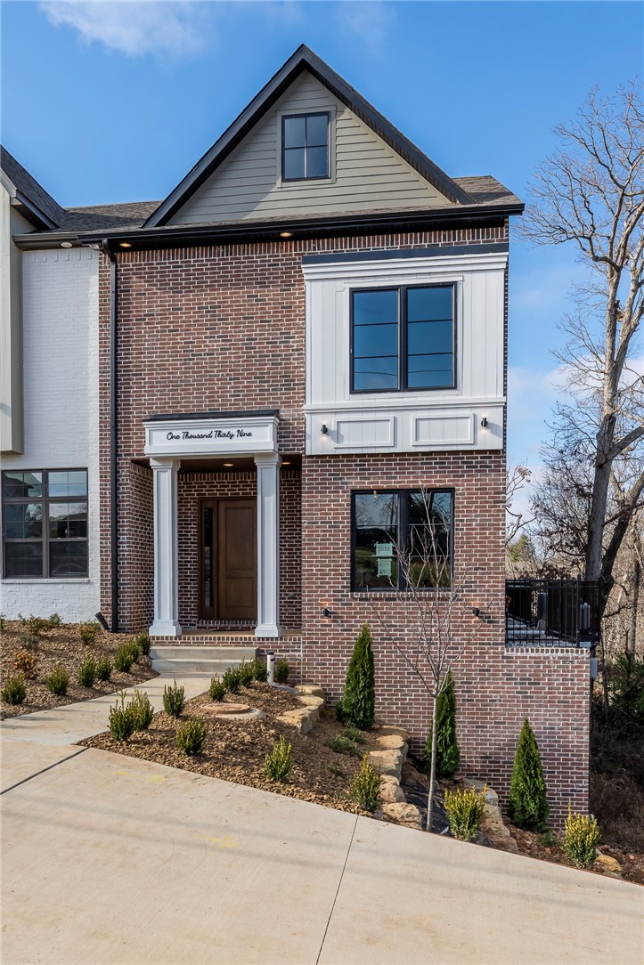 This is not a typical townhome. At over 3,500 square feet, 1039 NW A Street lives like a single family residence - main living across two floors, third floor reserved for a flex space and private entertaining deck overlooking Park Springs Park and the trail system. A second patio off the primary suite for quiet mornings.
This home does not back up to the trails. It neighbors them directly. Mountain bike and walking trails from your back door — no car needed. Walk to the downtown square, Crystal Bridges, and Bentonville's best restaurants. Everything within reach. Nothing sacrificed.
Inside, modern meets traditional in a design that feels curated and thoughtful. A music nook, bespoke finishes, and a modified plan available that converts part of the bonus room to a fourth bedroom.
The POA covers landscaping, exterior window washing twice yearly, weed control, and Christmas lights. Lock the door and go. Come home to perfect.
The alternative to a big house. Finally, downtown.