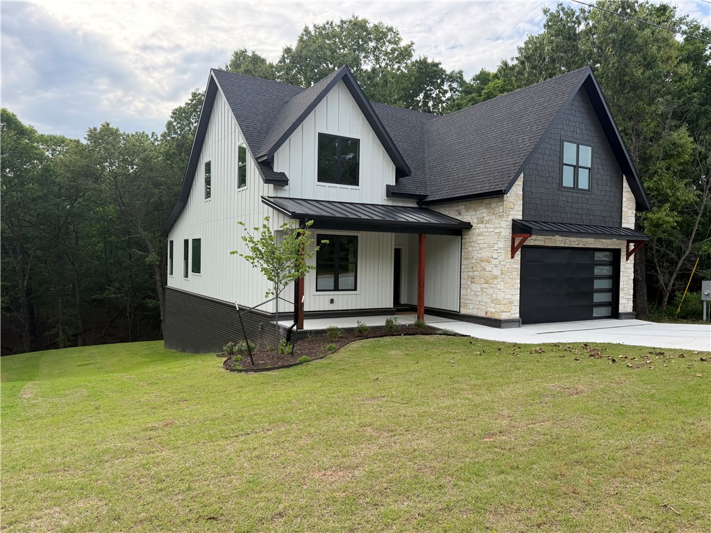 Quality craftsmanship, peaceful wooded views, over an acre, and a HUGE unfinished basement! With a mix of timeless and modern styles, this well-crafted and beautifully finished home has 4 bedrooms, an office or den, a bonus room, & 4 full bathrooms, plus 1587+- square feet of unfinished basement with high ceilings & plumbing! Basement not included in square footage. Enjoy the security of a safe room / tornado shelter, a yard to play in, and a beautiful wooded view. Two nice flat yard areas in the side and back to play! Tons of extra value in the basement: use it as it is, or turn it into an exercise / workout area, workshop, mother-in-law suite, or use the thoughtfully planned multiple entries for extra income! Great opportunity for multi-generational living if that's what you need. 360 degree virtual tour available on separate site - just like you are walking through it! (Ask agents) Homes with over an acre, endless storage, and with this convenient location are very difficult to find - come see it!