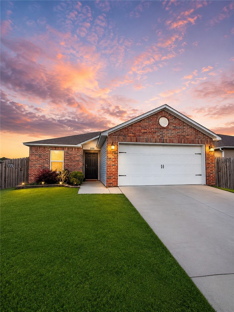 Welcome to this 2021 build home in the desirable Park Meadows subdivision in Fayetteville. This 3 bedroom, 2 bathroom  home offers 1209 heated square feet with a open concept layout. The kitchen features bar seating and rich wood cabinetry, flowing seamlessly into the living and dining areas. The spacious primary suite includes a walk-in closet and a private bath, while secondary bedrooms offer flexibility for guests or home office. Step outside to a fenced backyard with room to relax or play. Complete with a 2 car garage and located near I-49, shopping, dinning, and Fayetteville schools. Just 6 minutes away from the University of Arkansas. Enjoy a covered patio and low-maintenance yard for gatherings.