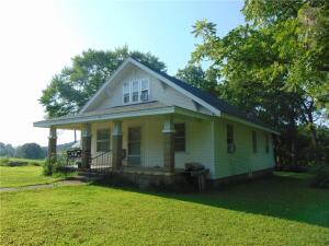 Nice home with a country setting. This home features 4 bedrooms and 1 bathroom. Home has been well cared for and has newer carpet along with nice hardwood floors. This house was used as a rental and rented for $750 with renters paying utilities. Property is originally this home and 220 acres and recently sold and new owners are keeping the land and selling the home off. House is already fenced off and will be surveyed before closing.