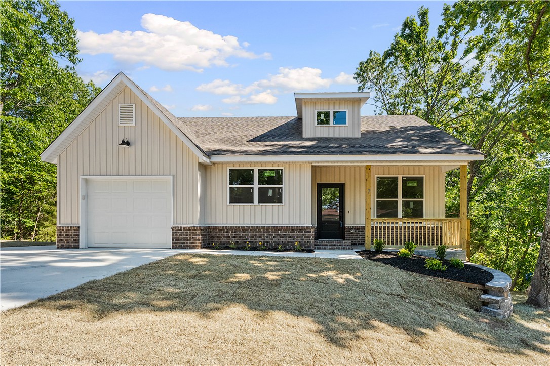 Welcome to this brand-new 2-bedroom, 2-bath home in the ever-growing mountain biking destination of Bella Vista—offering incredible value whether you're looking for a primary residence, weekend getaway, or investment property.
Step inside to soaring vaulted ceilings that create a bright, open feel throughout the living room and kitchen. Durable luxury vinyl plank flooring runs throughout the home—no carpet anywhere! 
Outside, the curb appeal shines with a welcoming covered front porch, a side deck perfect for relaxing, and a private, wooded backyard that captures the natural charm Bella Vista is known for. 
As a property owner, you’ll enjoy access to amenities through the POA, including lakes, golf courses, fitness centers, pools, and more. Plus, you’re minutes from I-49 with easy access to Bentonville and Rogers.
Don’t miss this opportunity—ask for the 3D tour or schedule your private showing today!