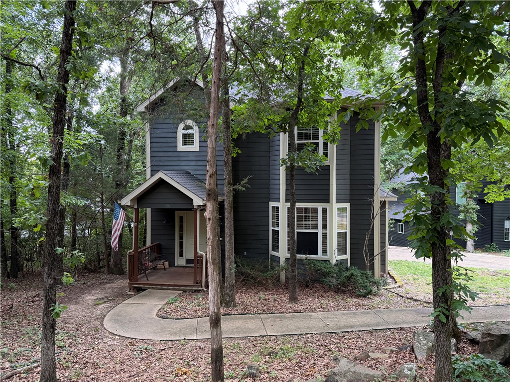 Inside, you'll be welcomed by gorgeous engineered hardwood floors, a cozy gas log fireplace, updated lighting, recessed lighting, and an abundance of windows dressed with classic plantation shutters that fill the home with natural light. The open-concept layout creates a seamless flow between the living area and formal dining room, making it perfect for entertaining family and friends. The beautifully remodeled kitchen features timeless white cabinetry, elegant quartz countertops, and a stainless steel gas range, offering both style and functionality. With all bedrooms conveniently located upstairs, the main level provides generous living and entertaining space. Retreat to the spacious primary suite featuring plush new carpet and a luxurious en-suite bath complete with a double-sink vanity, walk-in shower, and built-in soaking tub. Two additional bedrooms with new carpet and another 1.5 bathrooms provide plenty of space for family, guests, or a home office.