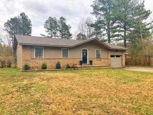 Stunning home on almost 1/2 an acre on the edge of town within walking distance to the country club. The minute you step inside you'll feel right at home in the open floorplan that invites you with lovely wood floors and a big bright kitchen.  There are three bedrooms and two full baths with modern fixtures.  There is even a bonus room that makes a great 4th bedroom or office!  Outside you'll find a covered patio, additional carport, and storage building!   There is so much to love in this beautiful yet budget friendly home!