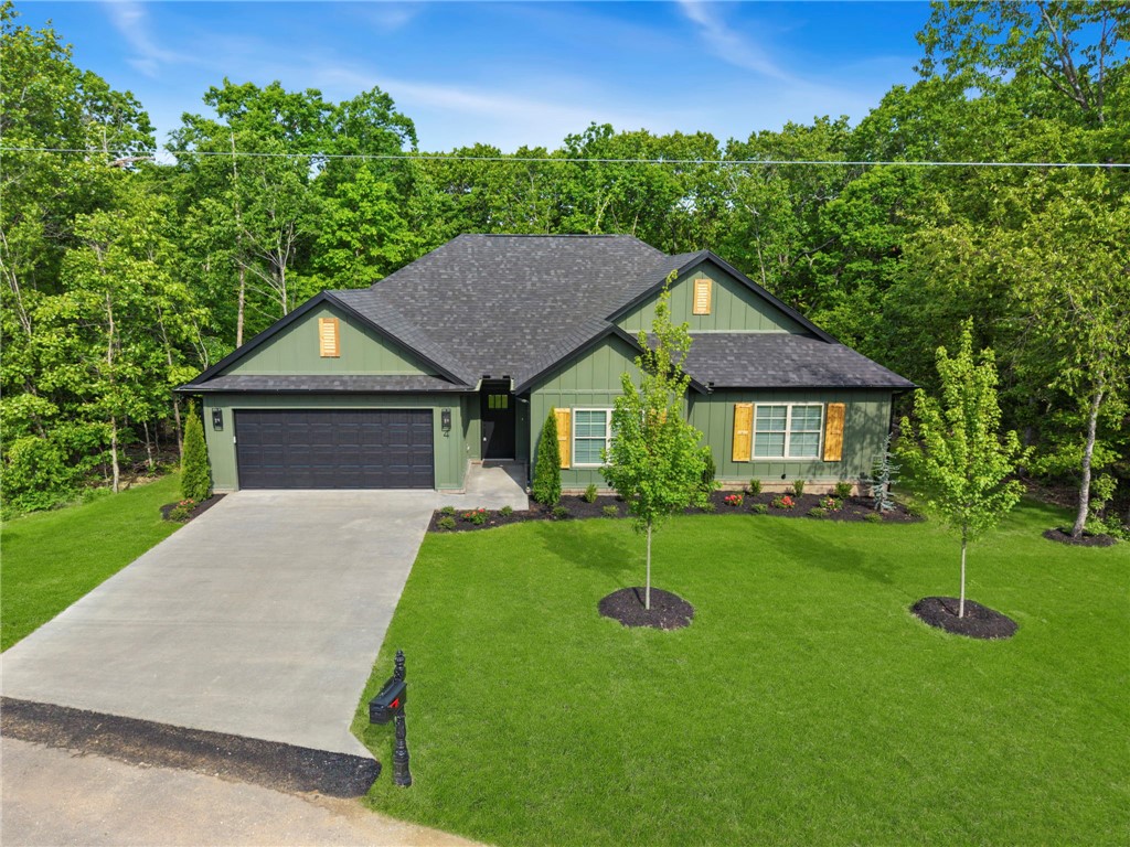 Beautifully crafted 1,950 sq ft home in the heart of Bella Vista! This 2 bed, 2 full bath home plus dedicated office offers a perfect blend of comfort and functionality. Enjoy an open, light-filled layout with spacious living areas, a cozy fireplace, and a stunning kitchen featuring ample cabinetry and a large island—ideal for entertaining. The primary suite provides a relaxing retreat, while the additional bedroom and office offer flexibility for guests or remote work.

Step outside to a covered back deck overlooking a peaceful, level yard—perfect for outdoor living. Storage is abundant throughout the home, making organization effortless.

Located within short walking distance to Branchwood Recreation Center, enjoy access to pools, fitness center, pickleball courts, and scenic paved trails. Plus, you’re just minutes from Loch Lomond for boating, fishing, and lakeside relaxation. A perfect combination of lifestyle, location, and livability!