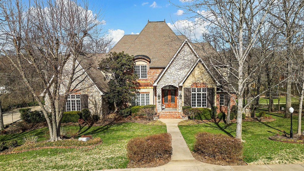 Welcome to this spectacular European-designed home, nestled on 0.77 acres in the prestigious Savanna neighborhood. This Krughoff Custom masterpiece boasts high ceilings, an elegant, curved staircase & exquisite craftsmanship. The main level features a spacious office with built-in cabinetry, a formal dining room, a cozy living room with a fireplace, a large kitchen with casual dining, and a hearth room with another fireplace. The main-level primary suite offers ultimate privacy, along with convenient access to the laundry room. Upstairs, 3 bedrooms, 2 bathrooms & large walk-in storage. The amazing walkout lower level is perfect for entertaining, with a den, a 5th bedroom, a full bathroom & extra storage. Walk out to the back yard, beautifully landscaped with an inground chlorine pool added in 2016/hot tub 2019. The 3-car garage adds extra convenience. Additional luxury features include copper fascia, finials, and a cupola. Updates: new kitchen countertops, faucet, stovetop. New paint & ceiling light cans throughout