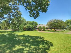A Stately and Beautiful home on the west end of Russellville and is ready for a new family.  This home has so much to offer with over 3,500 sqft and almost 3 acres! Inside you'll find a large family room with a fire place, office/play room, formal dining room, a kitchen with plenty of storage, and two master suites.  Outside, there is a cute, covered patio. This is the perfect place for watching the kids and grand kids play in the in-ground pool. Also, a two car detached shop and a fully fenced in backyard.