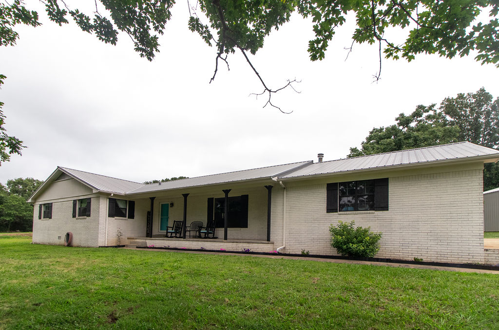 Beautifully updated brick home on approximately 10 acres. The property includes a 30' x 35' metal shop with 12' side walls, 200-amp electrical service, and 6" concrete floors, making it ideal for equipment, vehicles, or other projects. Property also includes pole barn and chicken coop.  Updates include new dishwasher and gas stove in 2023, new water heater installed in 2020, metal roof installed in 2016, HVAC replaced in 2001. Professional photos coming soon.