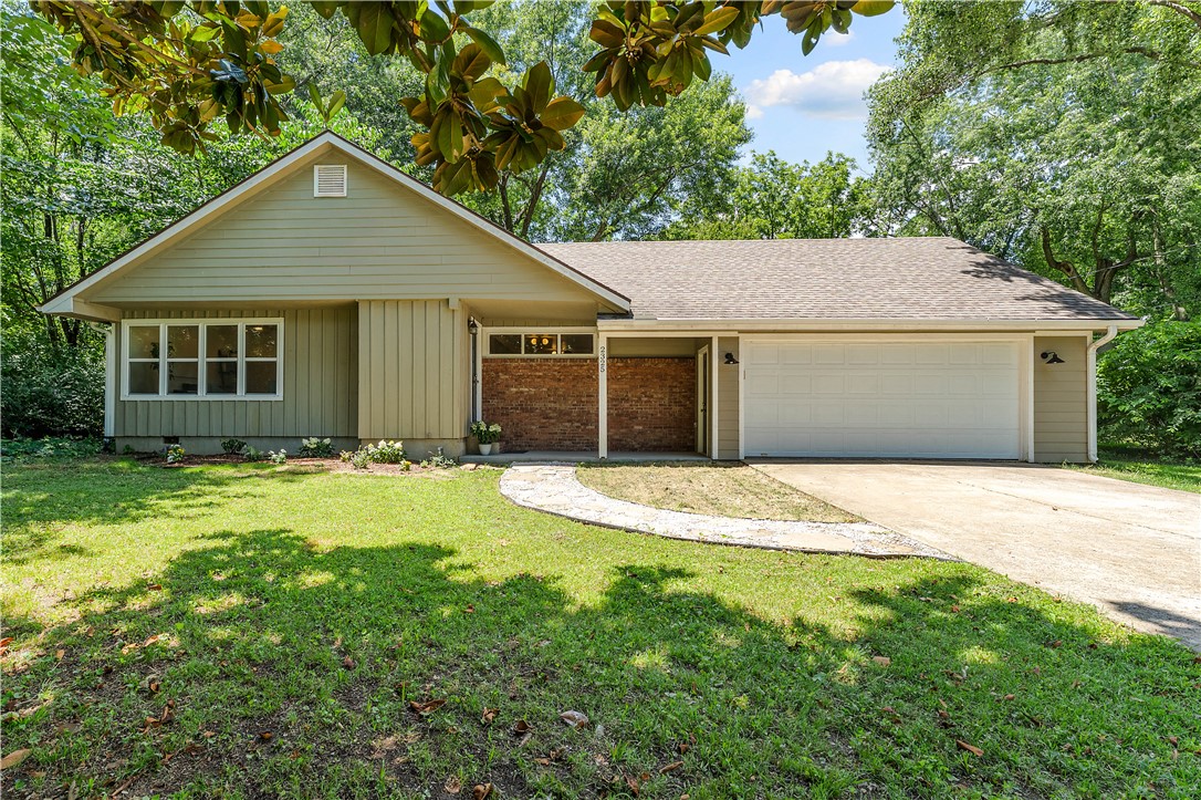 Timeless character meets modern living! This beautifully updated 4-bedroom, 2- full bath home sits on nearly half acre in a prime Fayetteville location just 2.3 miles from the University of Arkansas and only 0.5 mile from Razorback Transit. Originally built in 1968 and extensively remodeled in 2016 with additional updates completed in 2025, this home blends classic charm with contemporary finishes. Enjoy original red oak hardwood floors, modern flat wall finishes, a fully remodeled kitchen featuring quartz countertops and brand new white oak flooring, updated bathrooms, refreshed plumbing, and a new water heater (2024). The oversized 2-car garage, mature trees, and expansive backyard provide privacy and plenty of room to entertain, garden, or build an ADU or guest house. Conveniently located near schools, parks, shopping, dining, and I-49, this property offers an exceptional opportunity as a primary residence or investment property.
