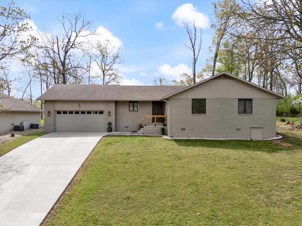 Seller to pay $5,000 of buyers closing cost and a home inspection with acceptable offer! This home has been completely remodeled with quality craftsmanship throughout.  The exterior features stained brick along with stained driveway, front porch & patio offering lasing durability. The driveway has also been treated with an anti-slip coating enhancing safety.  Inside you'll find an open concept layout that seamlessly connects the living room, dining area and kitchen-ideal for everyday living and entertaining. The kitchen features custom cabinetry paired with granite countertops, while bathrooms include elegant finishes such as marble countertops.  Heating is through and efficient electrical system, complemented by a ducted fireplace for added comfort. Additional highlights include a roof less than 10 yrs old, a flat backyard, close to Scotsdale golf course, Loch Lomond lake and Corral Dog Park. The quality of this home outdoes most new construction homes!