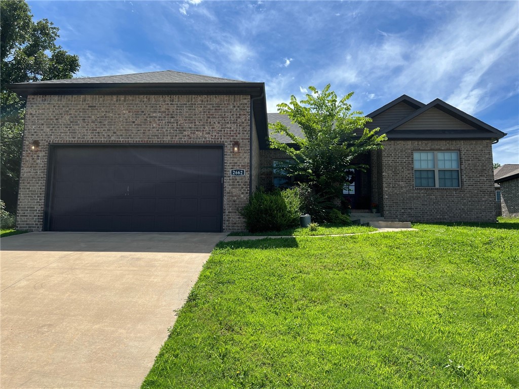 Nice home in Siloam Springs featuring 4 bedrooms 2 bathrooms with wood look ceramic tile in living room and kitchen, carpet in bedrooms, granite countertops, 2" faux wood blinds, nice fixtures, pantry, split floor plan, master suite complete with tub, separate shower, and walk in closet.