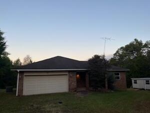 Home with a view!  Home sits on corner lot with awesome view on Mt ridge. This 3 bedroom 2 full bath is a split floor plan with a woodburning fireplace and walk-in shower in master bath. Sit outside on this 12x18 covered porch with a 12x16 deck off of it.