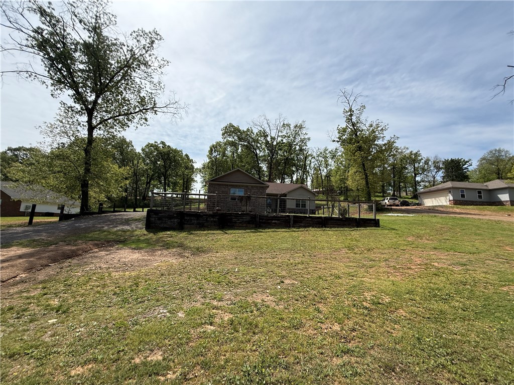 As an added bonus, sellers are offering $10,000 in buyer concessions to help with closing costs, making this an opportunity you won’t want to miss.

Located in Beaver Creek Estates,  3-bedroom, 2-bath home offers 1,574 square feet of well-designed living space on approximately 1 acre. The home features a split floor plan with the primary suite situated separately for added privacy. The primary bathroom includes double vanities, an oversized garden tub, and a walk-in shower. Interior finishes include granite countertops, stained millwork throughout, and black walnut fixtures, creating a cohesive and updated look. The kitchen comes equipped with all appliances, which convey with the property.
A newly constructed 20-foot front terrace provides additional outdoor living space. The property also includes a 2-car garage and an RV hookup for added convenience.  Property improvements include a prepared build site, already cleared and ready for a 40x40 secondary structure to suit your future needs.