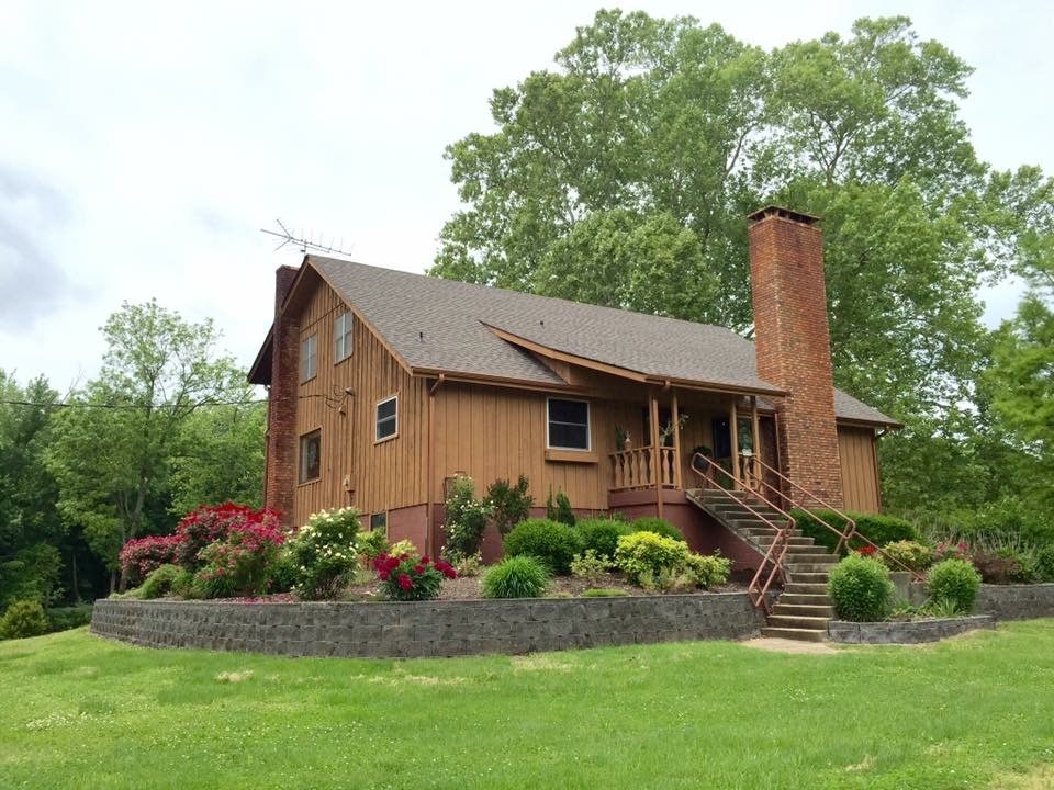 Beautiful Gorgeous Unique Property. Property fronts the Illinois River - Lovely landscaping, views galore! Home features hardwood flooring, main floor master, 2 living areas, open living areas. Nice sunroom with gorgeous views! This house is being discounted due to severe basement flooding history