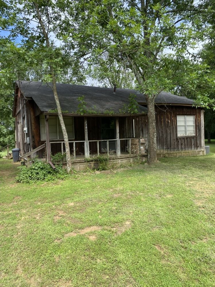 Being sold as is this house is ready for new owners! With a spacious yard that is almost 1/2 an acre and plenty of shade you can do all kinds of things. With a little TLC this house can be the talk of the town! With cedar siding and a unique kitchen set up the ideas for use are endless. Just minutes down the road from Lake Nimrod you get that small town living but still have that country get away!