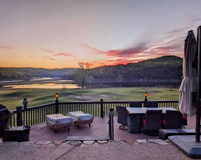 This meticulously maintained pull-in lot accommodates up to 45 feet motor coach. Oversized deck with built-in lighting offering spectacular views of the Disc Golf Course and Table Rock Lake. Decorative rock wall with steps leading to the freshly stained deck area. Nearby access to waterfront, ideal for fishing, boating, and water sports. Outdoor cooking station features a premium stainless steel BBQ grill ideal for entertaining and gourmet outdoor dining. Built-in outdoor refrigerator and sink with running water for ultimate convenience and clean up. Enhanced landscaping includes new low-voltage lighting, weed barrier installation, decorative rock beds, and an efficient drip irrigation system. Two mature shade trees, one of which is a stunning Japanese Maple tree enhancing the beauty and privacy of the lot. Oversized lot offers a golf cart charging station and ample room for a second vehicle. Full hookups including internet service, integrated security cameras and prime location near pool and bathhouse.