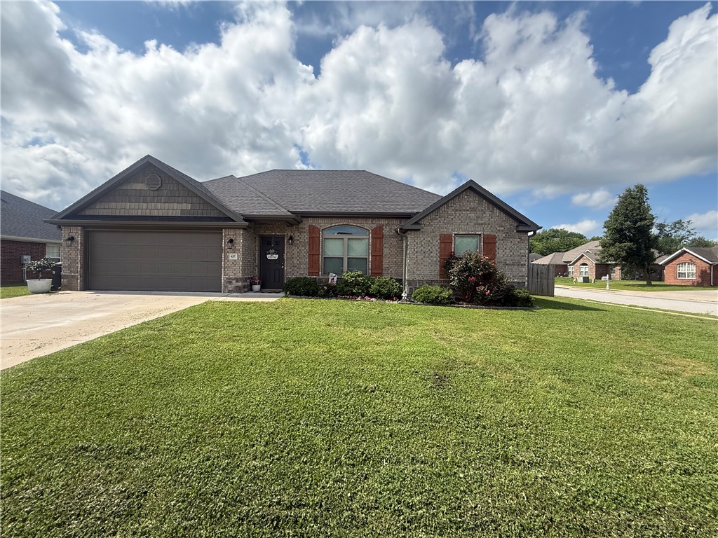 Well maintain in a convenient location! This 3-bedroom, 2-bath split floor plan home offers 1,532 heated sq ft with an open layout designed for comfortable living. Features include granite countertops, stainless steel appliances, eat-in kitchen, programmable thermostat, ceiling fans, and a spacious living area. Enjoy the privacy fenced backyard, covered patio, gutters, and landscaped corner lot. Brick, rock, and vinyl exterior with architectural shingle roof and 2-car garage. Located just minutes from Fayetteville, UOA and with easy access to Hwy 71B. Perfect for first-time buyers, investors, or anyone looking for low-maintenance living!