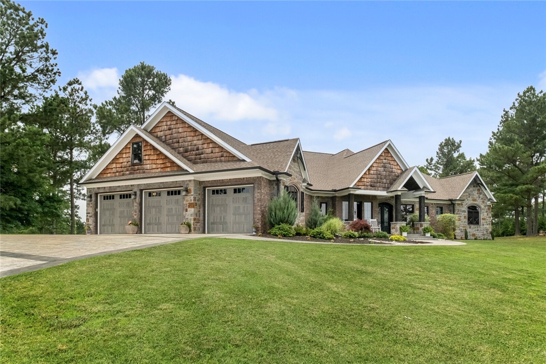 Talk about WOW....
This unbelievable custom home is on the market for the first time. 6,512 sq/ft on beautiful 5 acres. The list of custom features is a mile long including, 2X6 exterior walls, 8 ft tall interior door, huge ruff sawn timbers from the Oregon coast, the fireplace mantles are built from reclaimed wood from a church built in 1883, an 8x19 ft safe room, heated basement floors, commercial grade appliances, 3 fireplaces, a massive owners suite, multiple living areas, 2 kitchens, 8 bedrooms, office, 5 bathrooms and so much more.