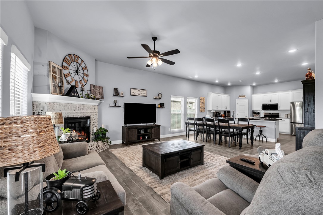 Welcome to 5339 Clear Springs Ave in Springdale's sought-after Deere Creek subdivision! This 2023-built, all-brick Craftsman home is move-in ready and shows like new. With 3 bedrooms, 2 bathrooms, and 2,059 sq ft, enjoy a split floor plan, cathedral ceilings, and granite countertops. The kitchen features a gas range, built-in microwave, dishwasher, pantry, and soft-close cabinets. The primary bath boasts a one-piece marble shower. Higher-grade insulation keeps energy costs low year-round. Relax by the electric fireplace or unwind on the covered patio in a fenced, landscaped backyard. A 2-car garage plus 120 sq ft storage building offer plenty of room. Walk-in closets, double-pane windows, ceiling fans, and a programmable thermostat round out the comfort features. Conveniently near shopping, hospitals, and I-49. Schedule your showing today!