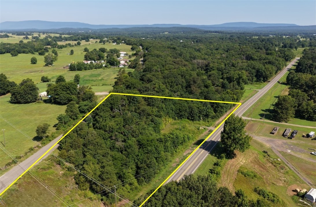 Private 4.2-acre wooded parcel along State Highway 27 in the Arkansas River Valley with electric service and fiber optic internet utilities on site.  Prelim perc test passed for septic system.

Two distinct buildable zones: a road-level access area with confirmed utilities and existing driveway apron off Hwy 27, and an elevated ridge site approximately 54 feet higher with sweeping views of the Arkansas River Valley and mountains to the east. Ideal for a mobile home, cabin, A-frame, tiny home, hillside retreat, or private getaway. 

Outside city limits. No HOA, no restrictions, no FEMA flood zone. 8 minutes to Danville, 20 minutes to Russellville, 25 minutes to Lake Dardanelle. 

Parcels like this — with electric, fiber optic, and a passed perc test already confirmed in a prime Arkansas River Valley location — are exceptionally hard to find at this price point. Inquire today